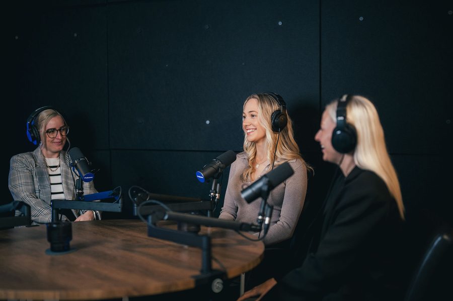 A business team recording a podcast